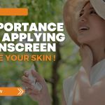 Smiling woman applying sunscreen outdoors while wearing a sun hat, symbolizing healthy sun protection and skincare habits.