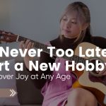 Older adult woman learning guitar at home — representing hobbies for older adults and the joy of lifelong learning.