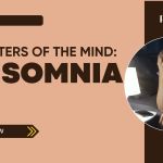Woman struggling with insomnia at night, sitting on her bed with her head in her hand beside a phone and lamp. Text reads “Matters of the Mind: Insomnia – Prime Magazine.”