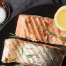 Rosemary and Garlic Roasted Salmon for Healthy Lungs, served with lemon and rosemary sprigs.