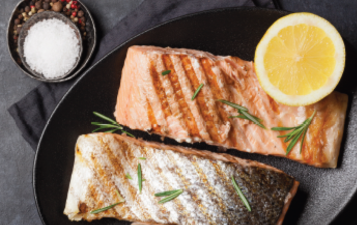 Rosemary and Garlic Roasted Salmon for Healthy Lungs, served with lemon and rosemary sprigs.