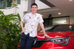 Dr Benjamin Yip, consultant gastroenterologist and founder of Alpha Digestive & Liver Centre, standing beside a red car outside his home.