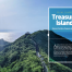 Taiwan travel guide: coastal ridge boardwalk with a pavilion above green cliffs and a calm sea under a clear sky.