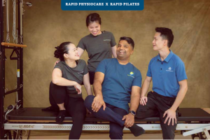 John Abraham and staff on a reformer