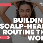 Woman massaging her scalp with both hands, promoting a healthy scalp-care routine with bold text reading “Building a Scalp-Health Routine That Works” from Prime Magazine.