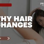 Young woman examining her hair in the mirror, wondering why hair changes