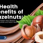 Close-up of hazelnuts with green leaves and smooth chocolate background, overlaid with the text “Health Benefits of Hazelnuts: The Hidden Hero Behind Chocolate and Heart Health.”