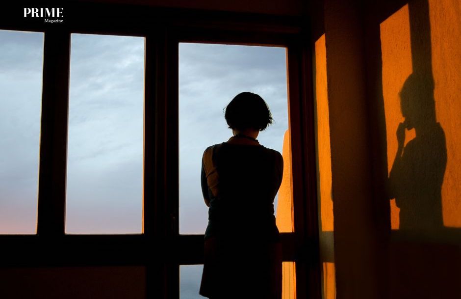 Person Looking Out Window (Reflection)