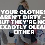 Woman doing laundry at home, highlighting the idea that clothes may look clean but are not always truly fresh