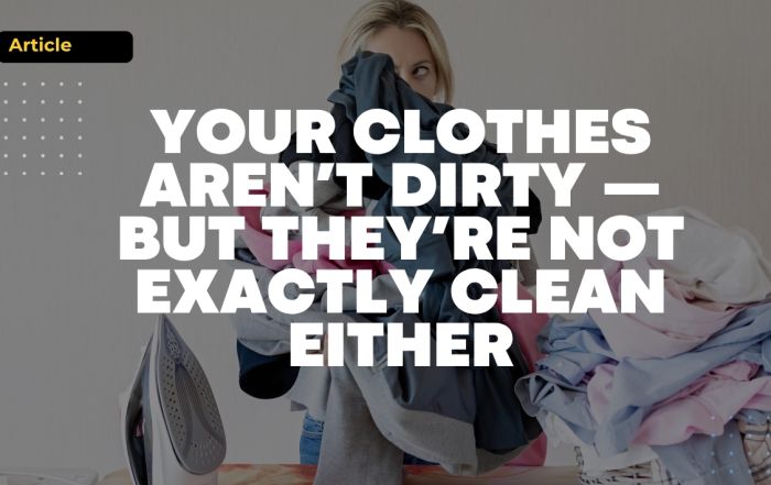 Woman doing laundry at home, highlighting the idea that clothes may look clean but are not always truly fresh