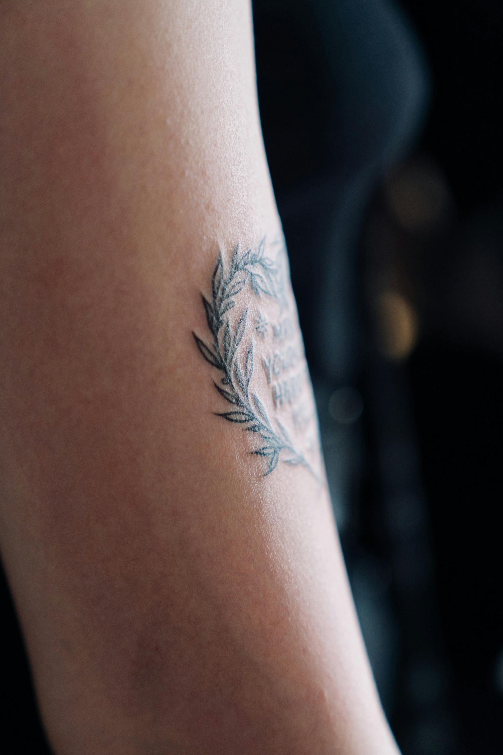 Minimalist forearm tattoo design on adult skin.