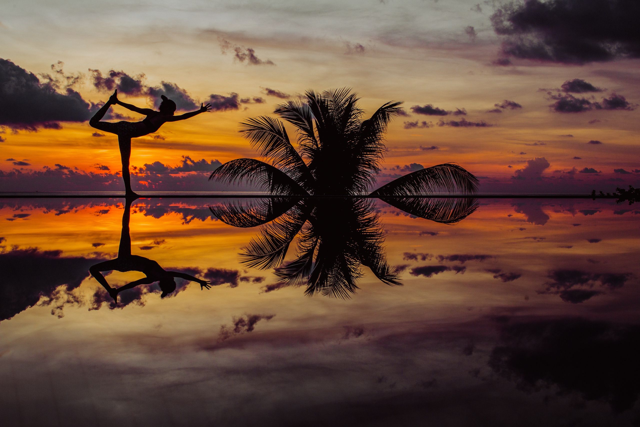 Sunrise yoga overlooking the sea at Garrya Tongsai Bay Samui, a luxury wellness retreat in Koh Samui.